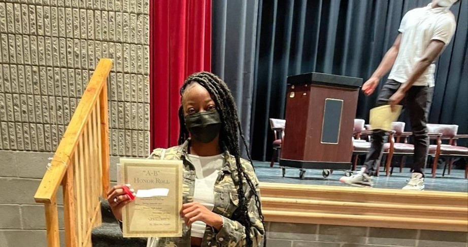Girl holding certificate